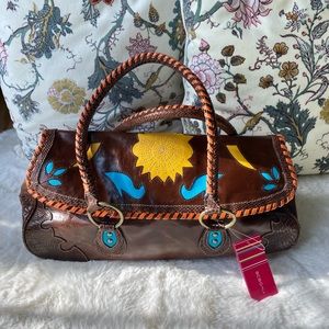 NWT BCBGirls fun and stylish, western chic handbag.